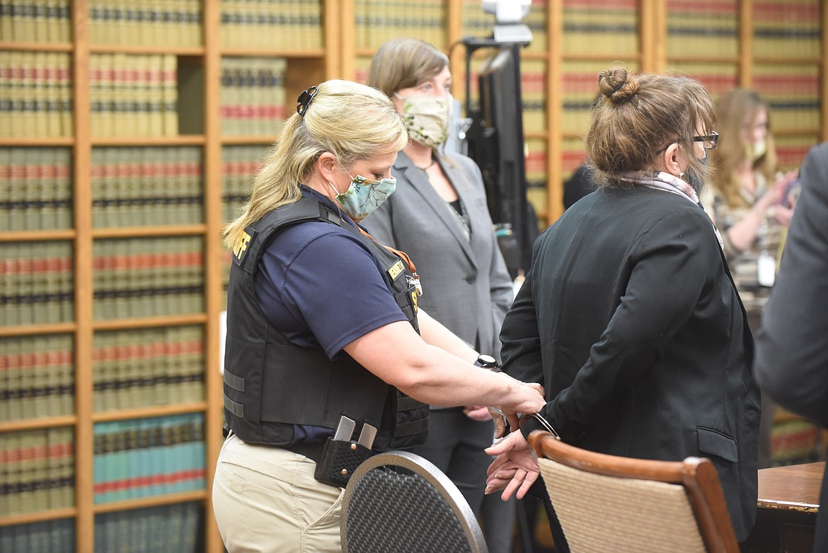 Danielle Jeanette Wood is handcuffed by Sanders County Sheriff's Office Lt. Shawna Chenoweth Friday afternoon after Wood was found guilty of killing her ex-boyfriend, Matt LaFriniere on May 2, 2018, in Thompson Falls. The jury returned its verdict at noon Friday in the Sanders County Courthouse in Thompson Falls. (Scott Shindledecker/Daily Inter Lake)