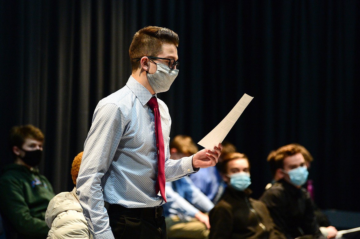 Senior Dresden Allred reads a note of encouragement from Kalispell Public Schools superintendant and former Glacier High School principal Micah Hill during a Glacier Wolfpack Speech & Debate team meeting on Friday, Jan. 29. The team read several notes from school staff members and alumni in advance of the state AA tournament. (Casey Kreider/Daily Inter Lake)