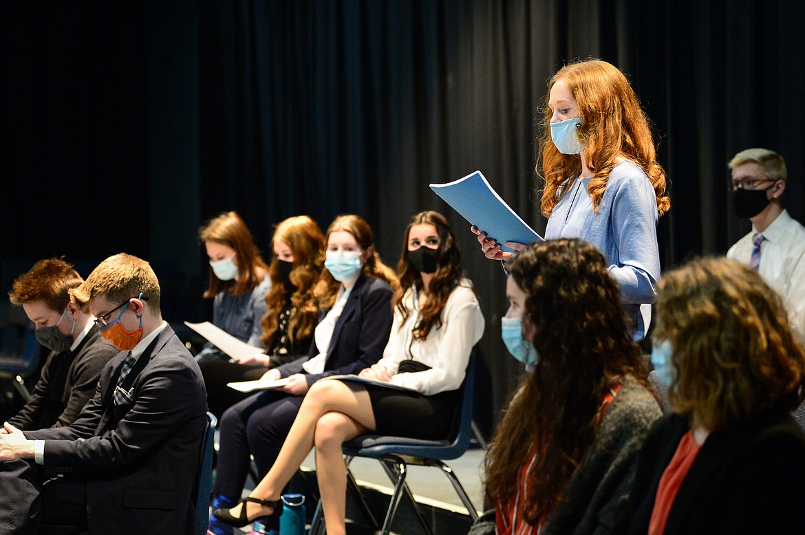 Junior Alexandra Houseworth reads one of many notes of encouragement from Glacier High School staff members and alumni during a Glacier Wolfpack Speech & Debate team meeting on Friday, Jan. 29. (Casey Kreider/Daily Inter Lake)