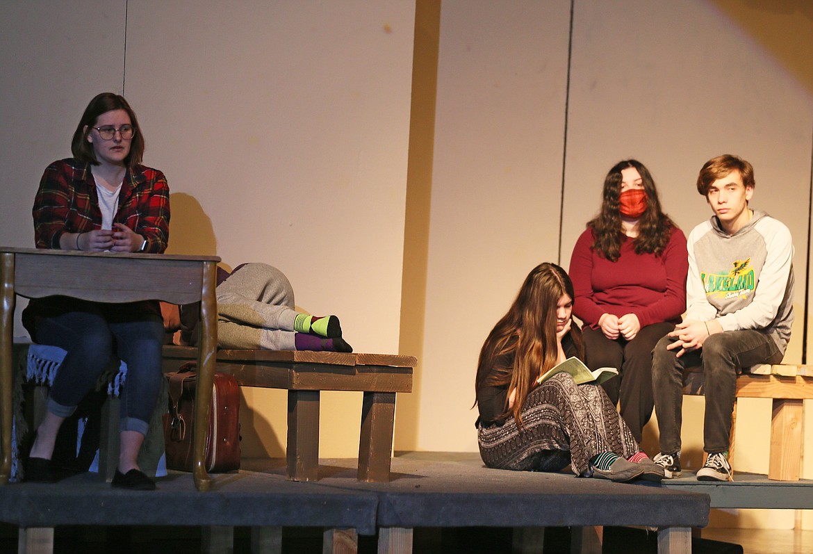 From left, senior Ashton Howerton, sophomore Amara Elliott (seated on the ground), senior Logan Kelly and junior Luke Ferguson rehearse a scene from "The Diary of Anne Frank" in theater class on Thursday. Drama, band, choir and other artistic extracurriculars are supported by the supplemental levy, which will be on the March 9 ballot.