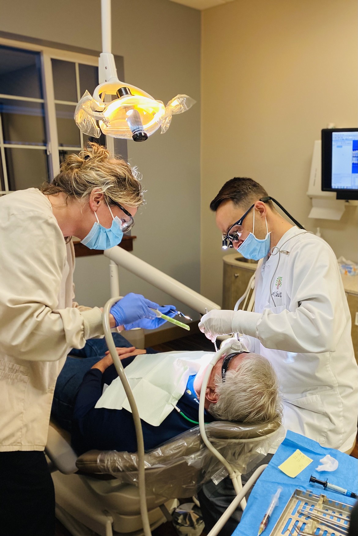 Courtesy photo
Hygienist Brandy Kitchin and Dr. Jason Allred work with patient BJ Deaustin at River City Dentistry.