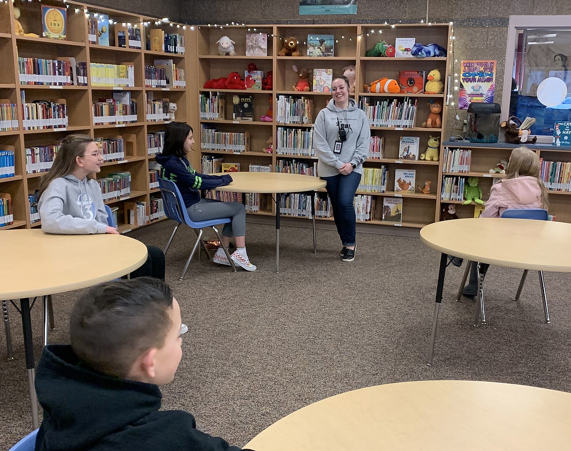 Twin Lakes Elementary school counselor Justine Litzko, standing, goes over activities and jobs for the upcoming week with a sixth grade leadership team she advises during a meeting Thursday. Litzko, who was named Idaho School Counselor of the Year by the Idaho School Counselor Association in 2019, will represent the Gem State this week during National School Counseling Week.