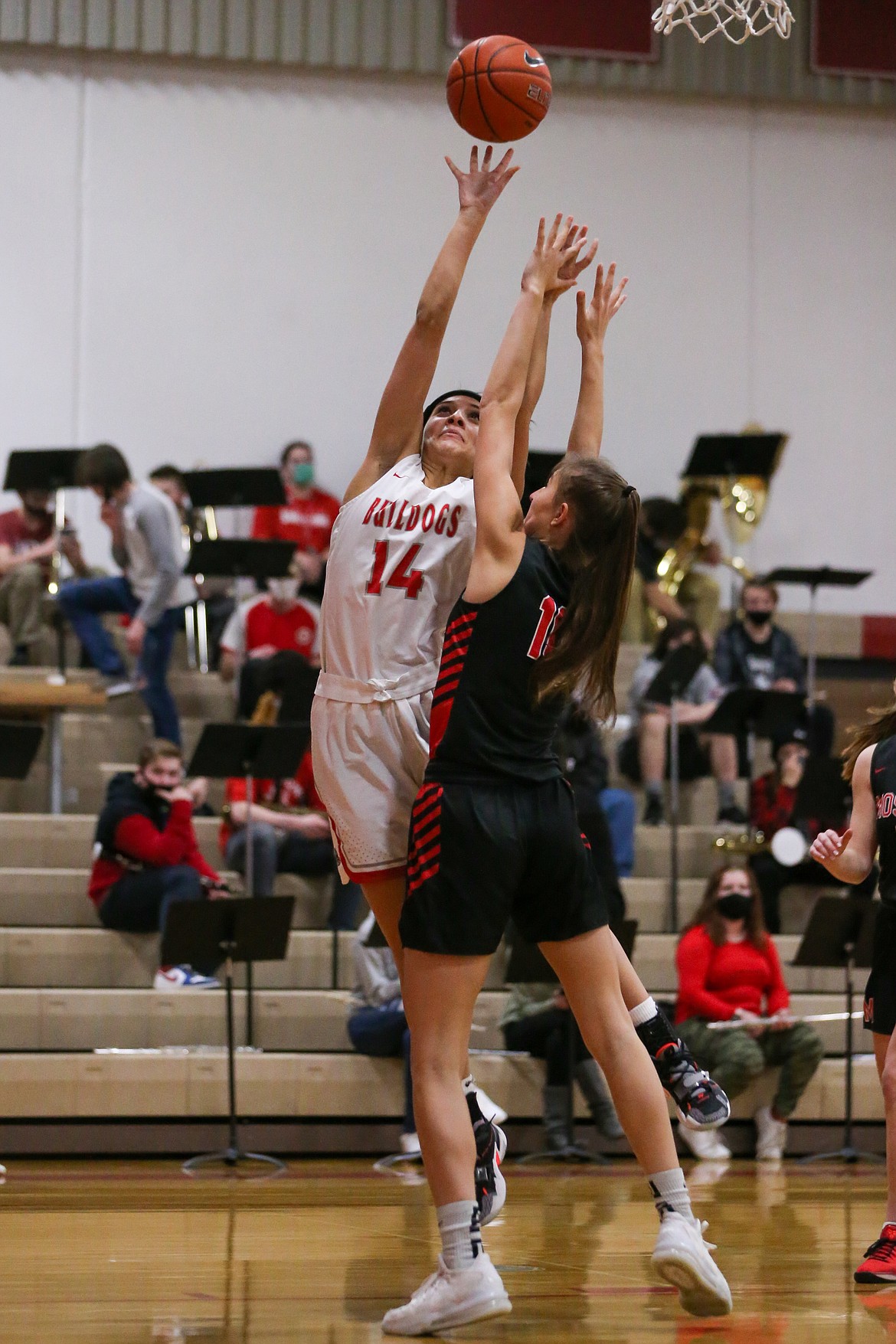 Senior Bella Phillips (left) elevates for a layup on Saturday.