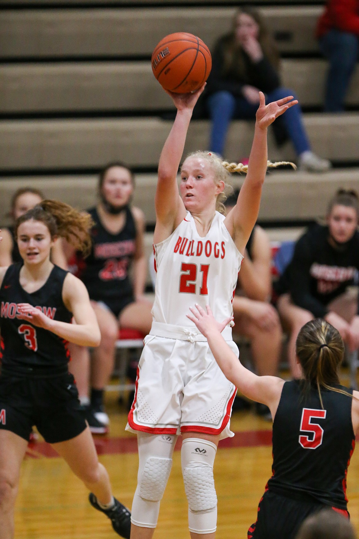 Senior Hattie Larson pulls up for a jumper during the first half of Saturday's game against Moscow.