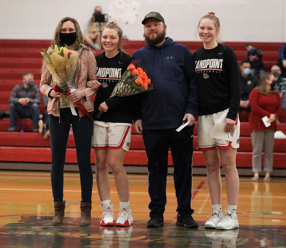 Kaylee Banks poses for a photo with her family on Senior Night.