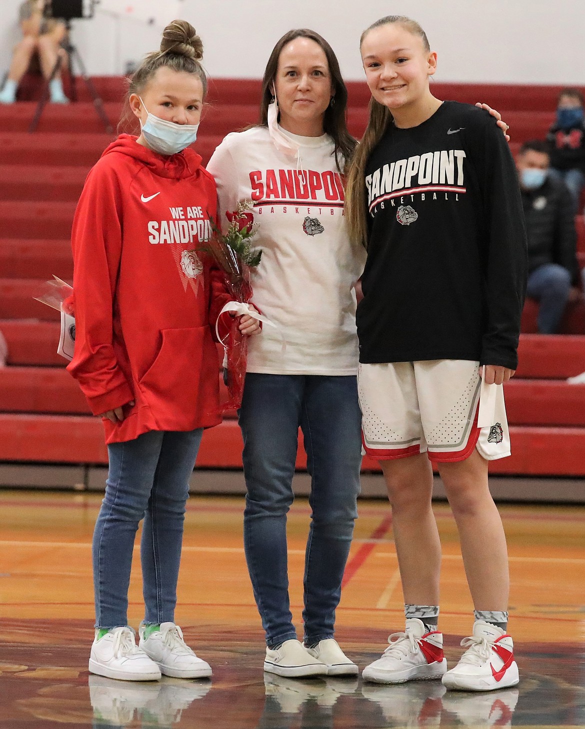 Lily Gammon poses for a photo with her family on Senior Night.