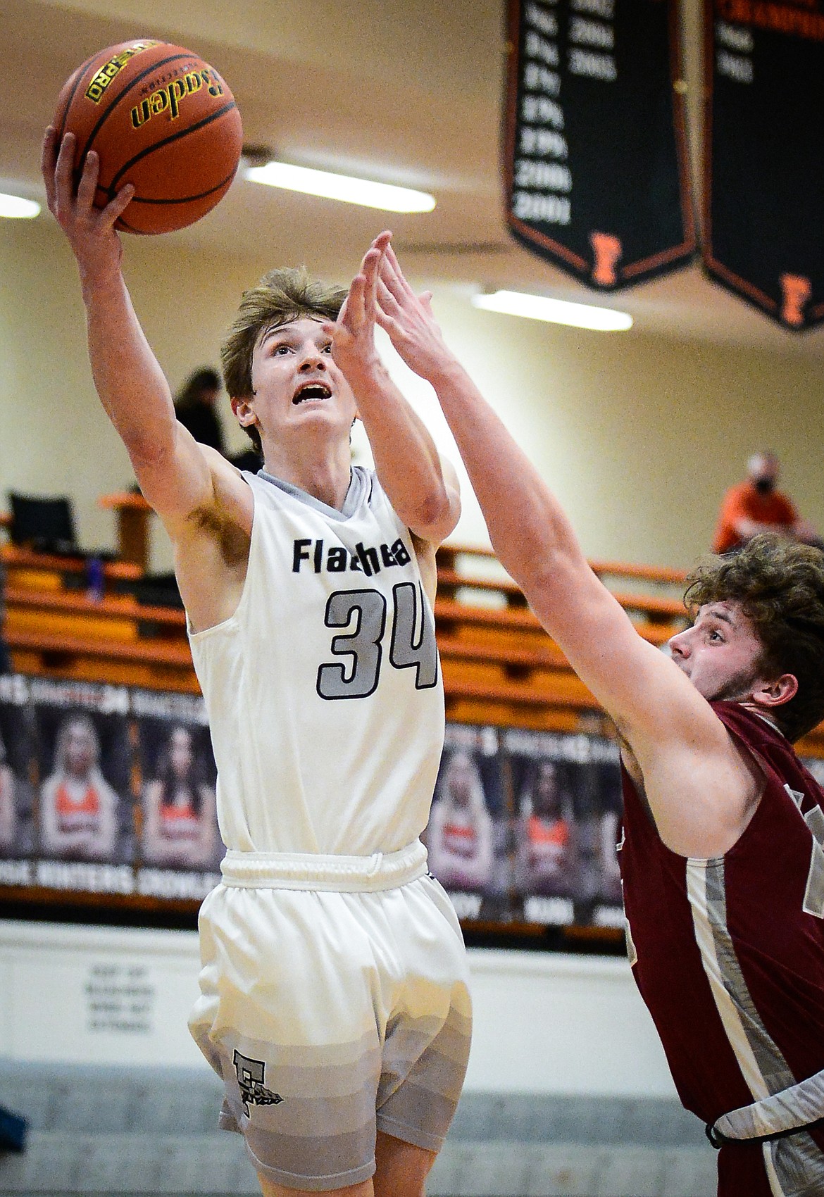 Flathead's Joston Cripe (34) drives to the basket against Helena at Flathead High School on Saturday. (Casey Kreider/Daily Inter Lake)