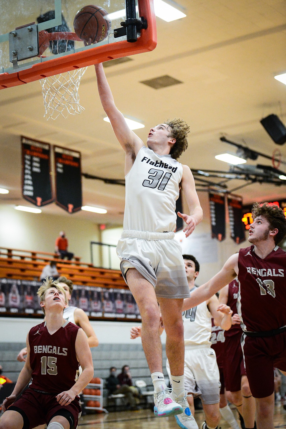 Flathead's Gavin Chouinard (31) lays in two points against Helena at Flathead High School on Saturday. (Casey Kreider/Daily Inter Lake)