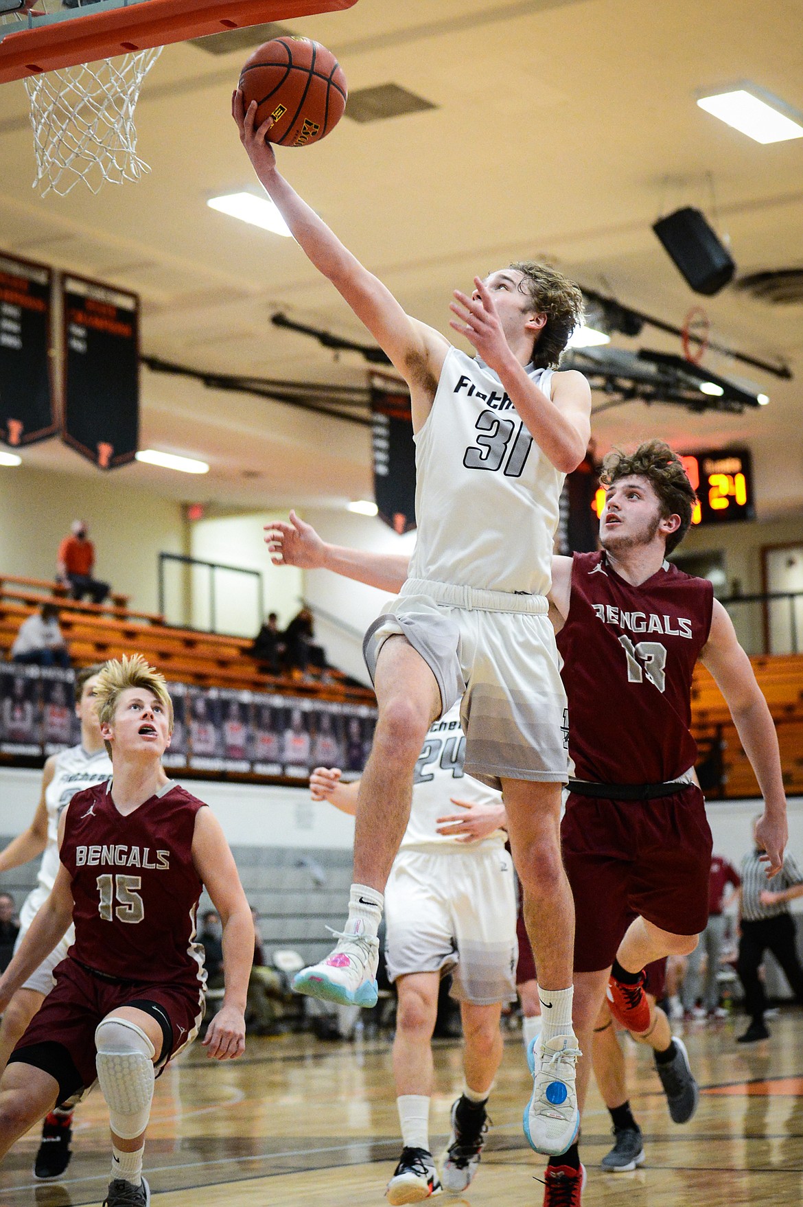 Flathead's Gavin Chouinard (31) lays in two points against Helena at Flathead High School on Saturday. (Casey Kreider/Daily Inter Lake)