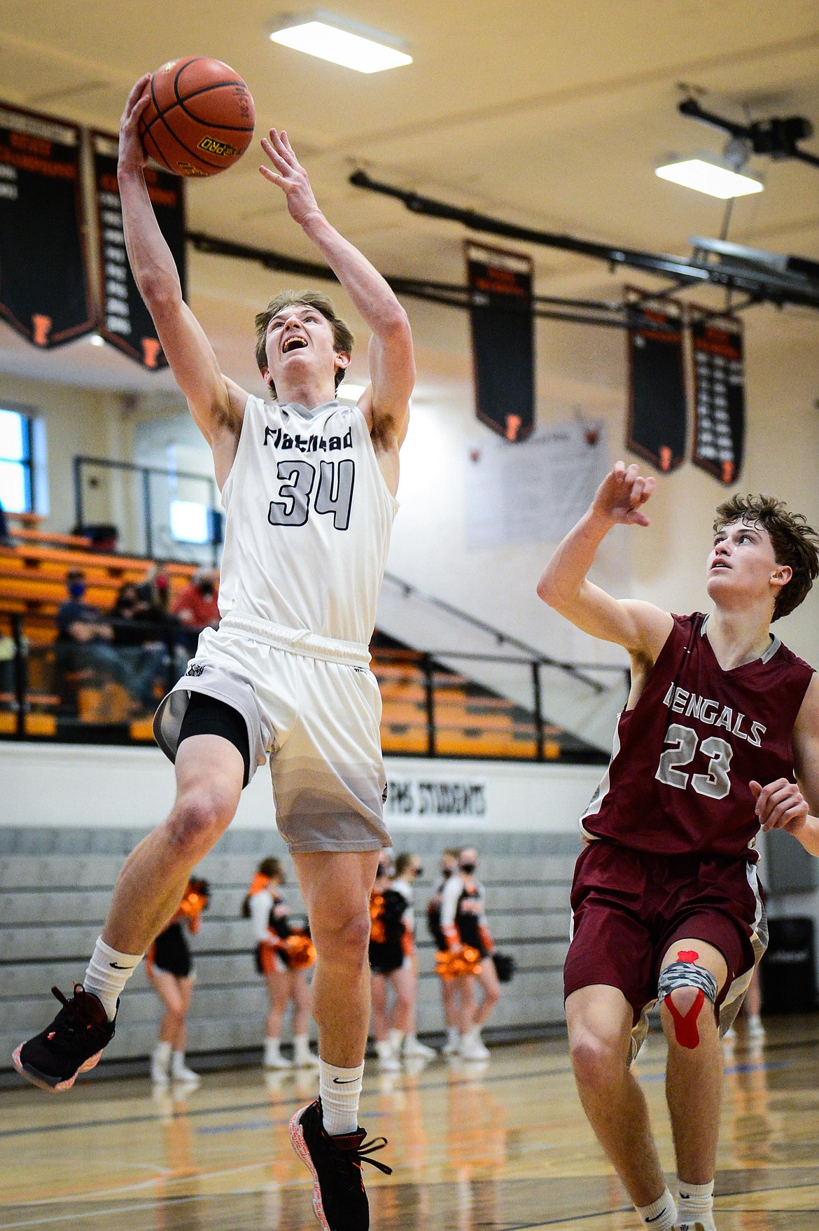 Flathead's Joston Cripe (34) drives to the basket against Helena at Flathead High School on Saturday. (Casey Kreider/Daily Inter Lake)