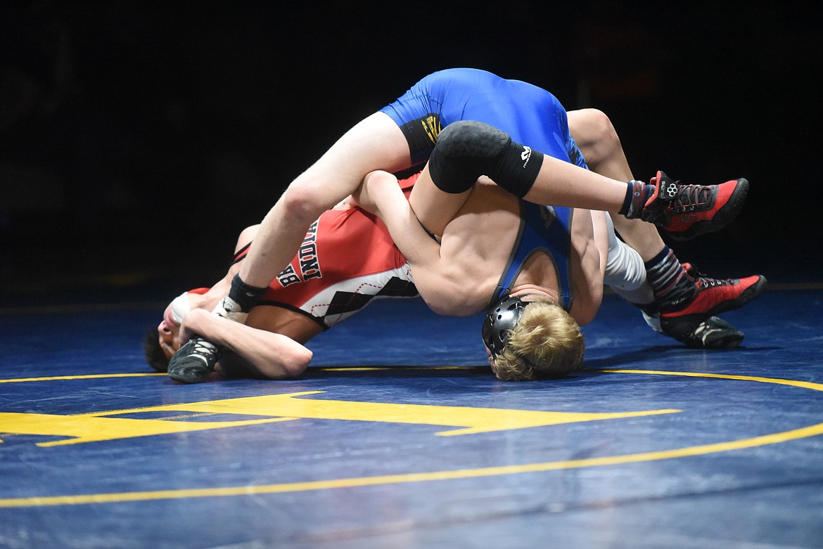 Senior Zach Morrison looks to take down Browning's Quentin Campos. (Will Langhorne/The Western News)