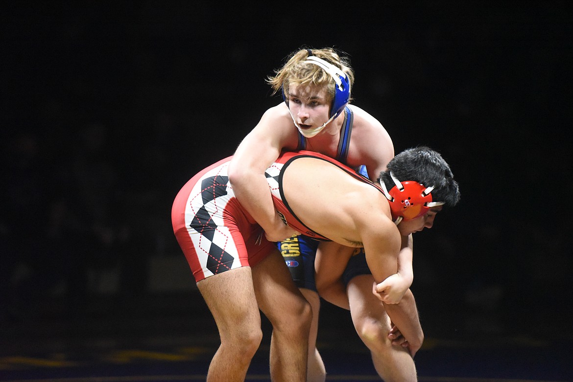 Freshman Joey Wise grapples with Browning's Jared Keene. (Will Langhorne/The Western News)