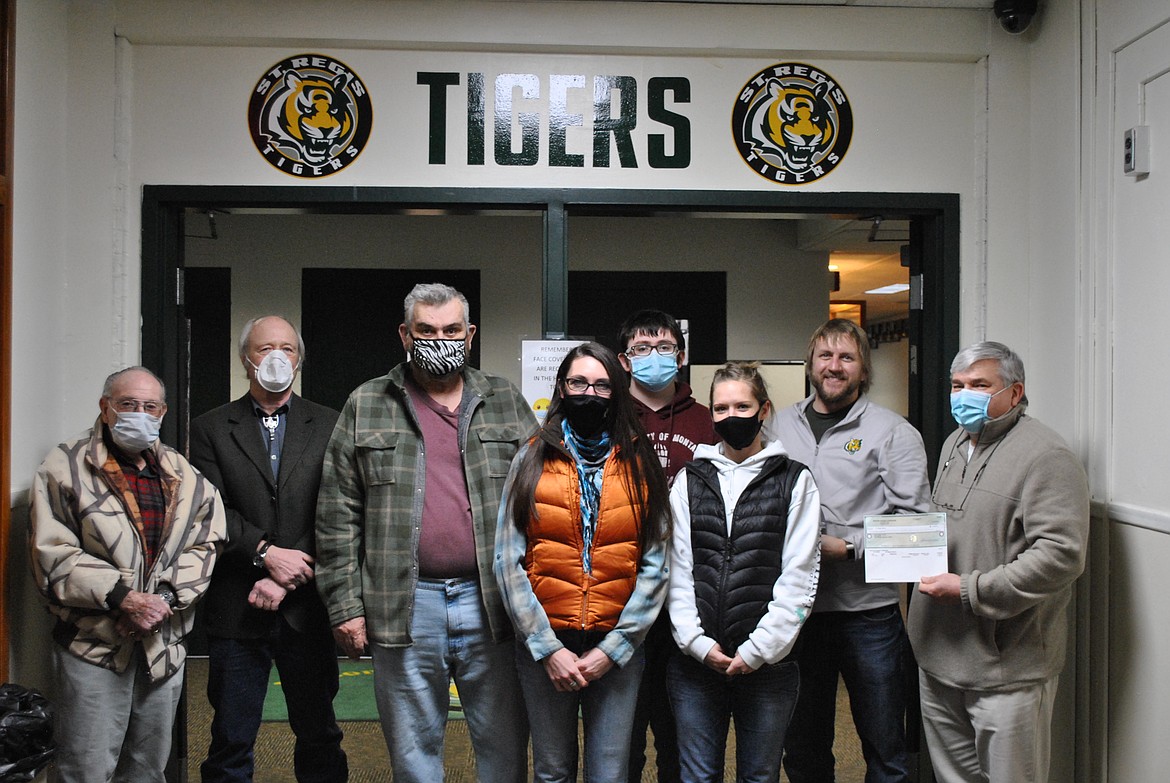 From left, are Bill Merriman, Kelly Dillon, and Ed Heppe from the Superior Masonic Mountain Lodge #110. School board members Stephanie Todd and Amber Leenhouts, band student Demor Hostetler, music teacher Derek Larson and superintendent Joe Steele were all present during the award of St. Regis' grant money from the Montana Masonic Foundation’s Educational Grant Program. (Amy Quinlivan/Mineral Independent)