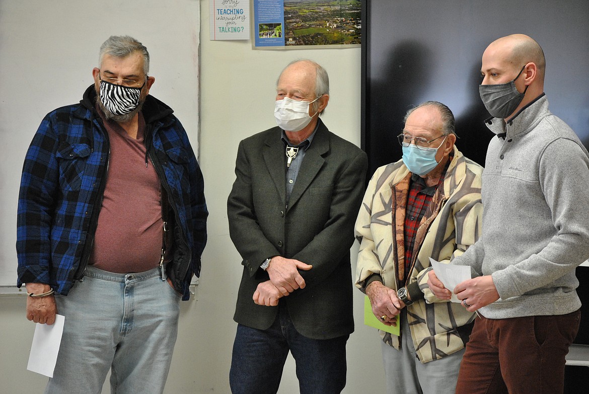 Masonic Lodge members Ed Heppe, Kelly Dillon, and Bill Merriman present a grant award to Superior science teacher Christopher Quinlivan during a video call with Superintendent Scott Kinney last Thursday. (Amy Quinlivan/Mineral Independent)
