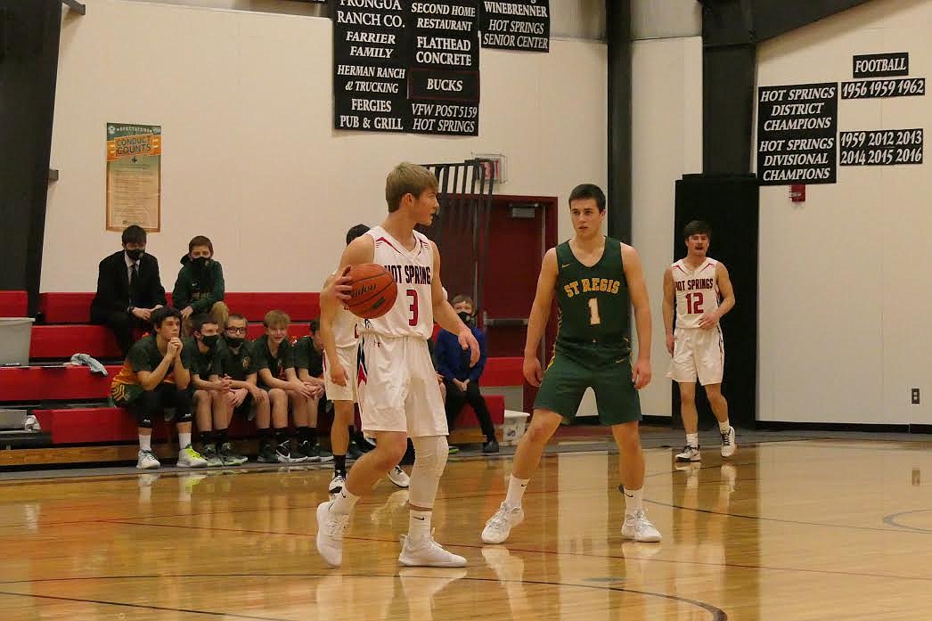 St. Regis’ Caleb Ball defends as Hot Springs’ Jack McAllister tries to get past him during their game Friday night. (Chuck Bandel/Mineral Independent)