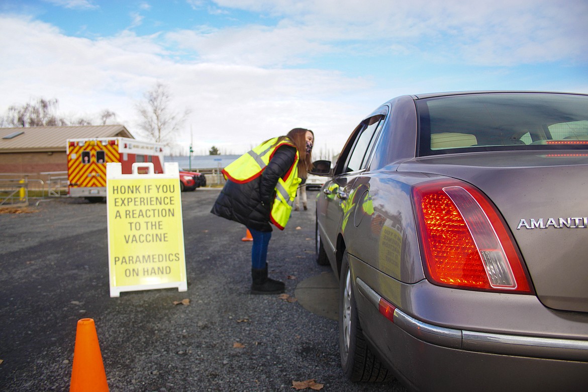 Samaritan nurse practitioner Kim Poole checking in on patients in the waiting area after vaccination on Saturday.