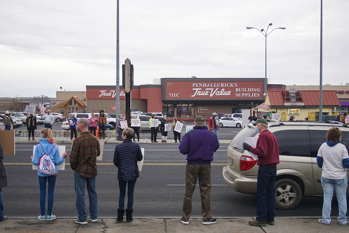 Protesters lined both sides of Stratford Road in Moses Lake on Sunday.