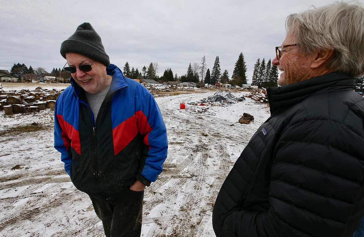 John Corcoran, right, talks with ElderHelp volunteer John Dobberthien on Saturday.