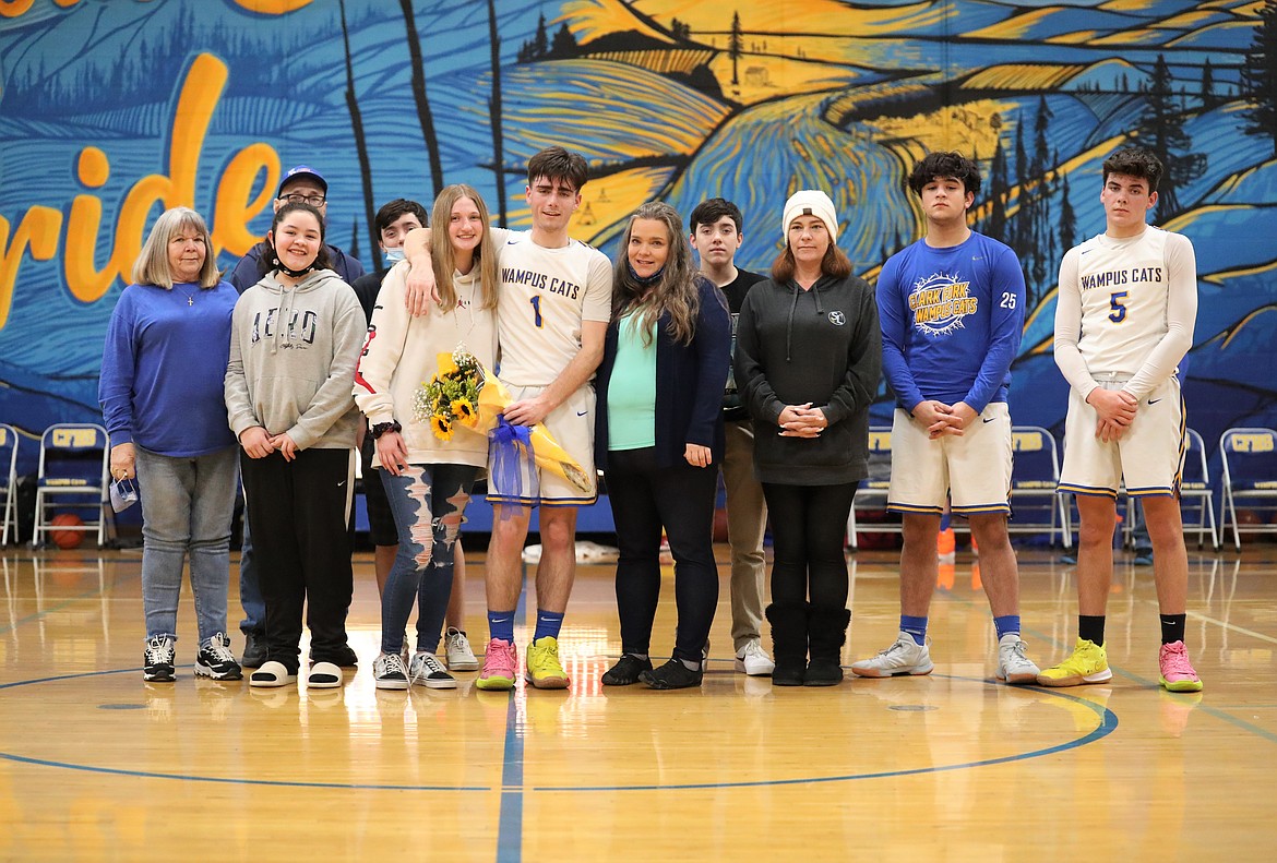 Cameron Garcia poses for a photo with his family on Senior Night.