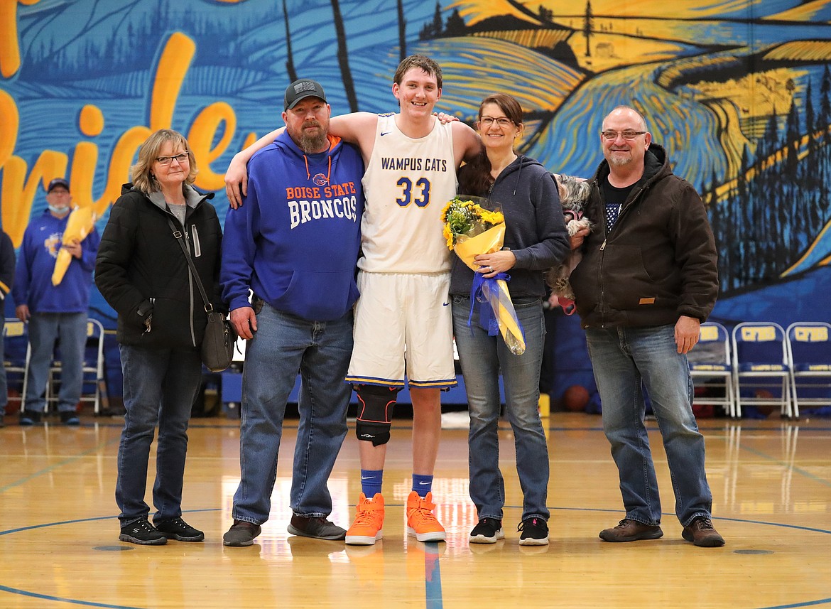 Chris Wade poses for a photo with his family on Senior Night.