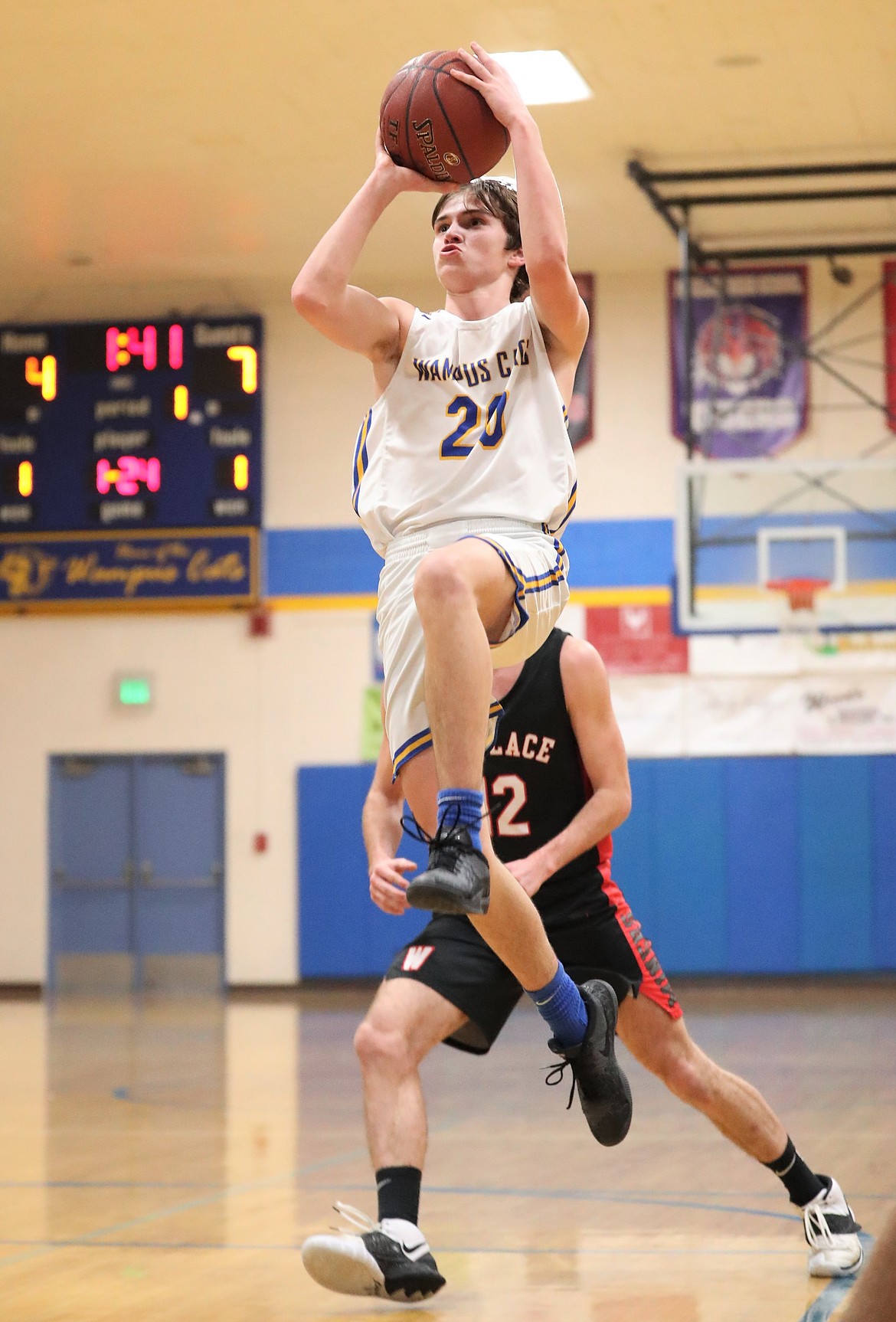 Junior Sam Barnett attempts a floater during the first half of Monday's game against Wallace.