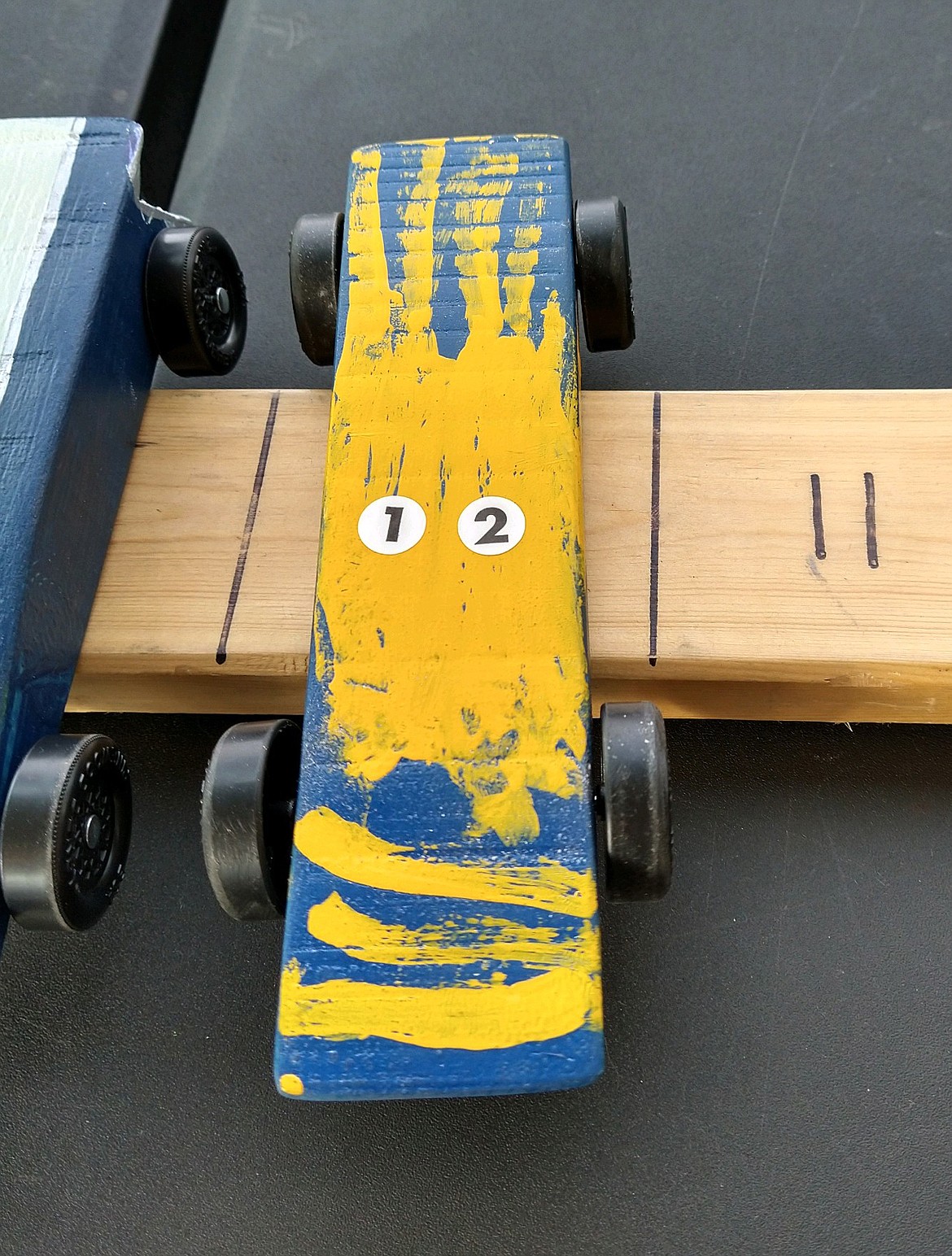 "Thunderbolt," Archie Underdahl's winning pinewood derby car, "is painted as a tiger, but it has the speed of a cheetah," Archie said. He and "Thunderbolt" swept the competition at his Cub Scout's pinewood derby on Saturday.