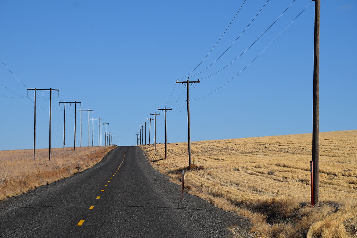 Power lines straddling a lonely stretch of the Lind-Warden Road in Adams Count in late 2019. The newly formed Adams Couny Broadband Action Task Force suggested that rural electric co-ops, like Big Bend Electric Cooperative in Ritzville, might have a significant role to play in ensuring high speed Internet is provided to every part of Adams County.