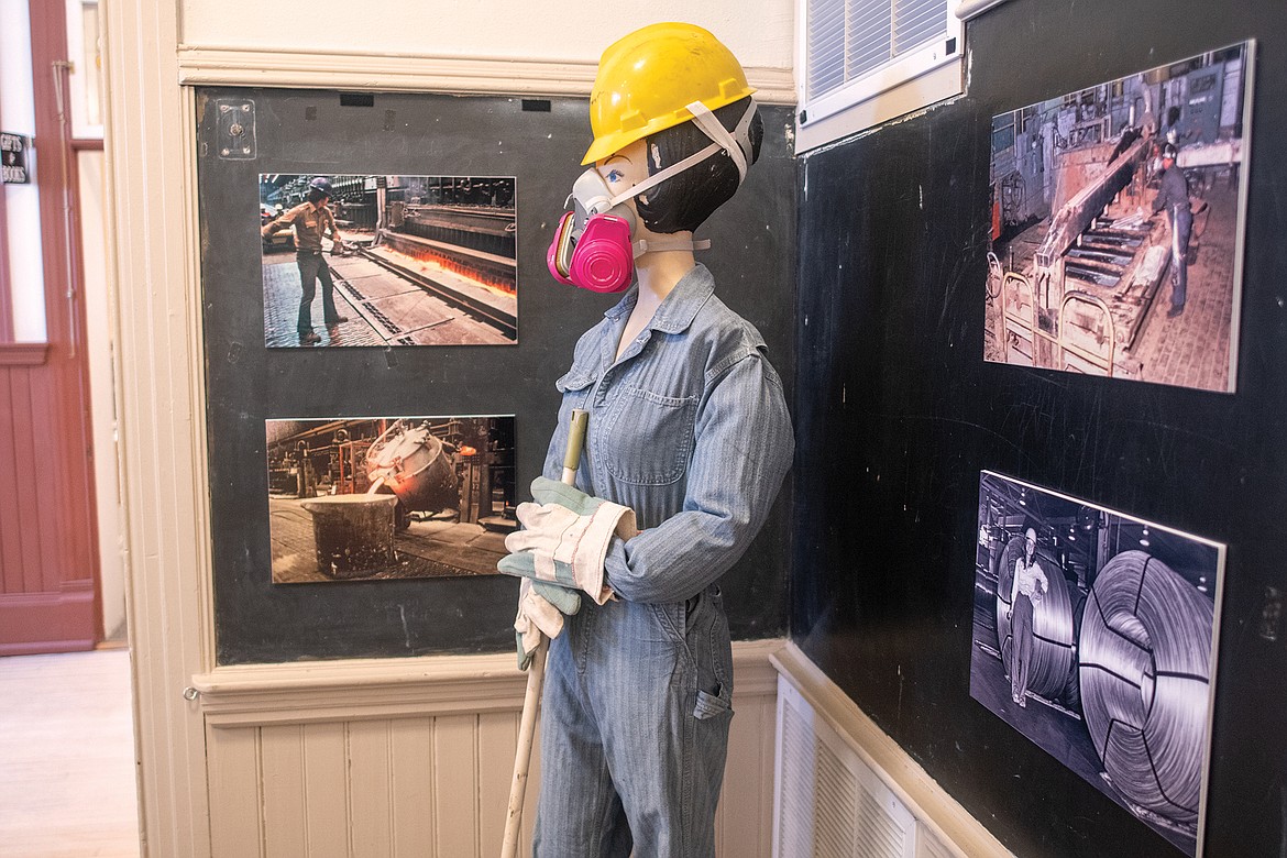 The CFAC display includes a woman's uniform and a host of historical photos.