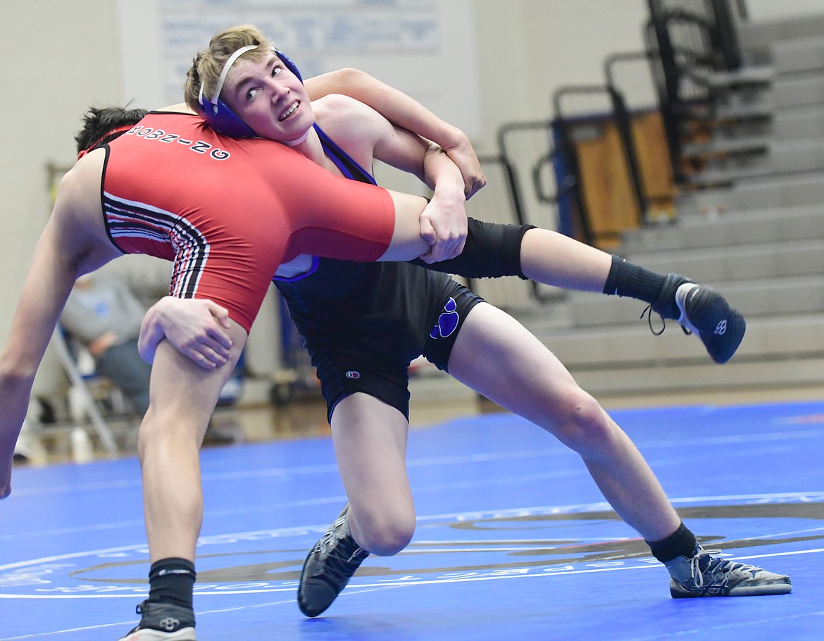 Colton Hogan goes for a takedown in a match against Browning on Saturday. (Teresa Byrd/Hungry Horse News)