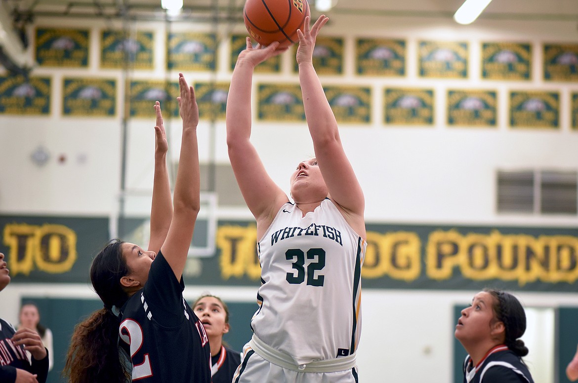 Whitefish senior Brook Smith rises up above the Browning defense to score during a game at Whitefish High School on Thursday evening. (Whitney England/Whitefish Pilot)