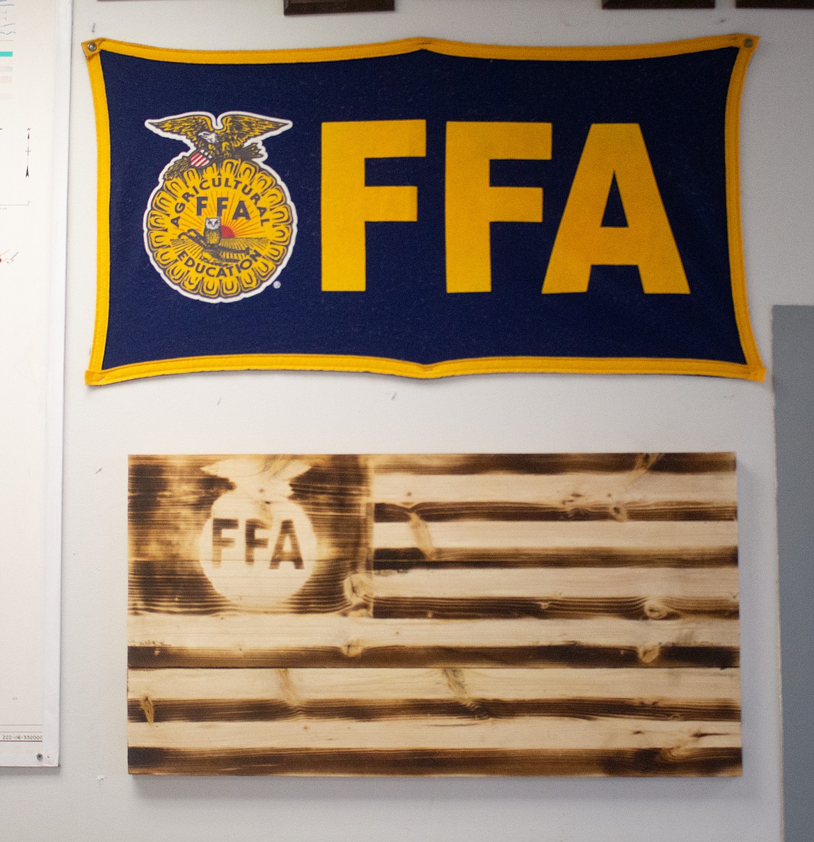 Austin Kern experimented with some wood-burning techniques while crafting this FFA sign hanging in his dad, Tony Kern's, classroom at MLHS.