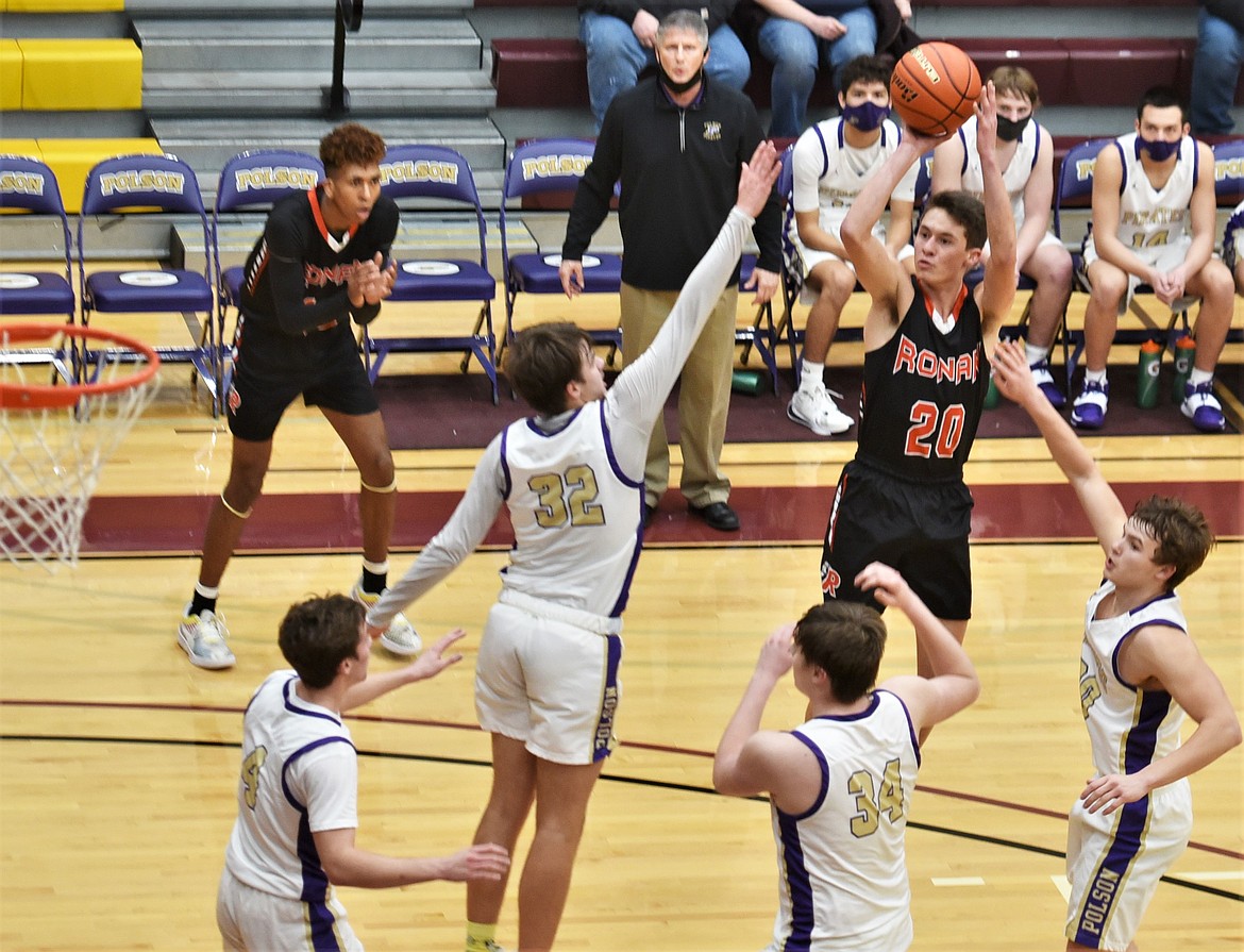 Ronan's Zarec Couture shoots over Polson's Colton Graham (32), Jarrett Wilson (20), Trevor Lake (34) and Xavier Fisher (4). (Scot Heisel/Lake County Leader)