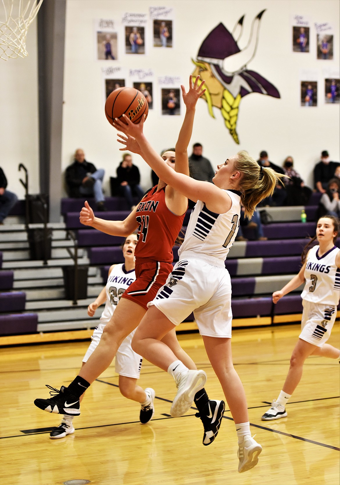 Charlo's Kassidy Cox puts up a shot as Noxon's Avery Burgess defends Saturday at Charlo. (Scot Heisel/Lake County Leader)