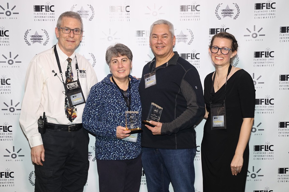 Becky and Greg Dupuis (center), owners of Showboat Cinemas, received the FLIC 2021 "Impact Award" from David and Jessica King for their contributions to the film festival.