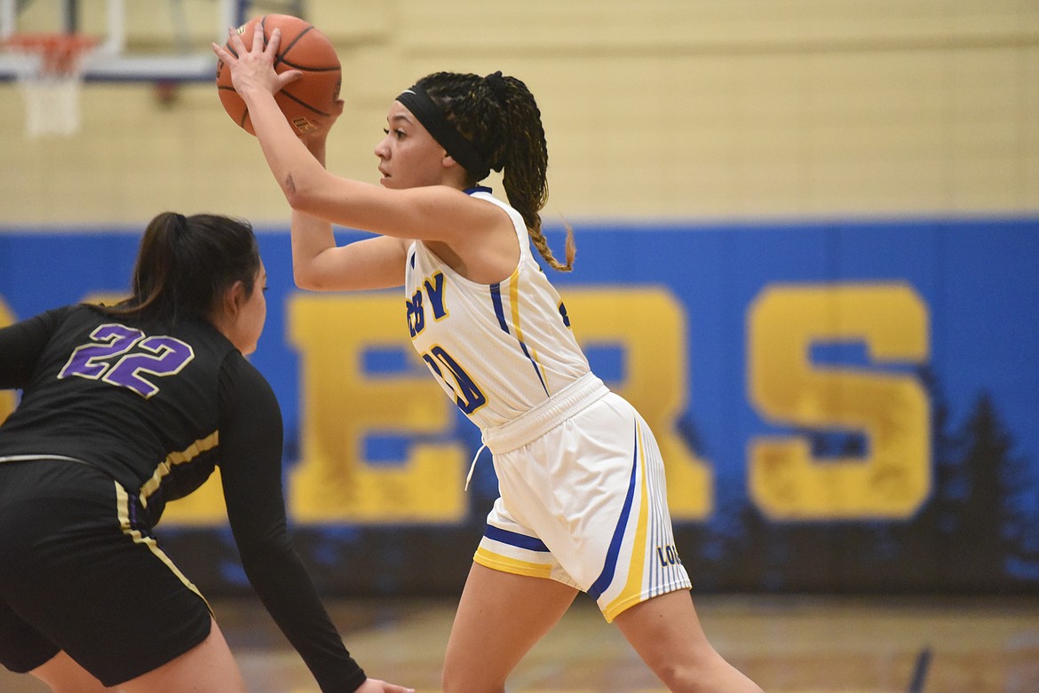 Libby senior Olivia Gilliam-Smith looks for the pass during the Lady Loggers Feb. 2 game against Polson. (Will Langhorne/The Western News)