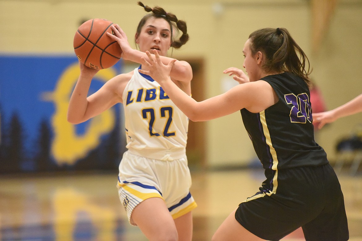 Libby senior Kayley Svendsbye looks for the pass during the Lady Loggers Feb. 2 game against Polson. (Will Langhorne/The Western News)