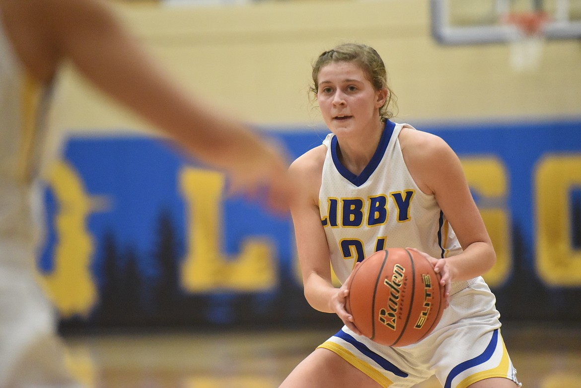 Libby senior Elise Erickson looks for the pass during the Lady Loggers Feb. 2 game against Polson. (Will Langhorne/The Western News)