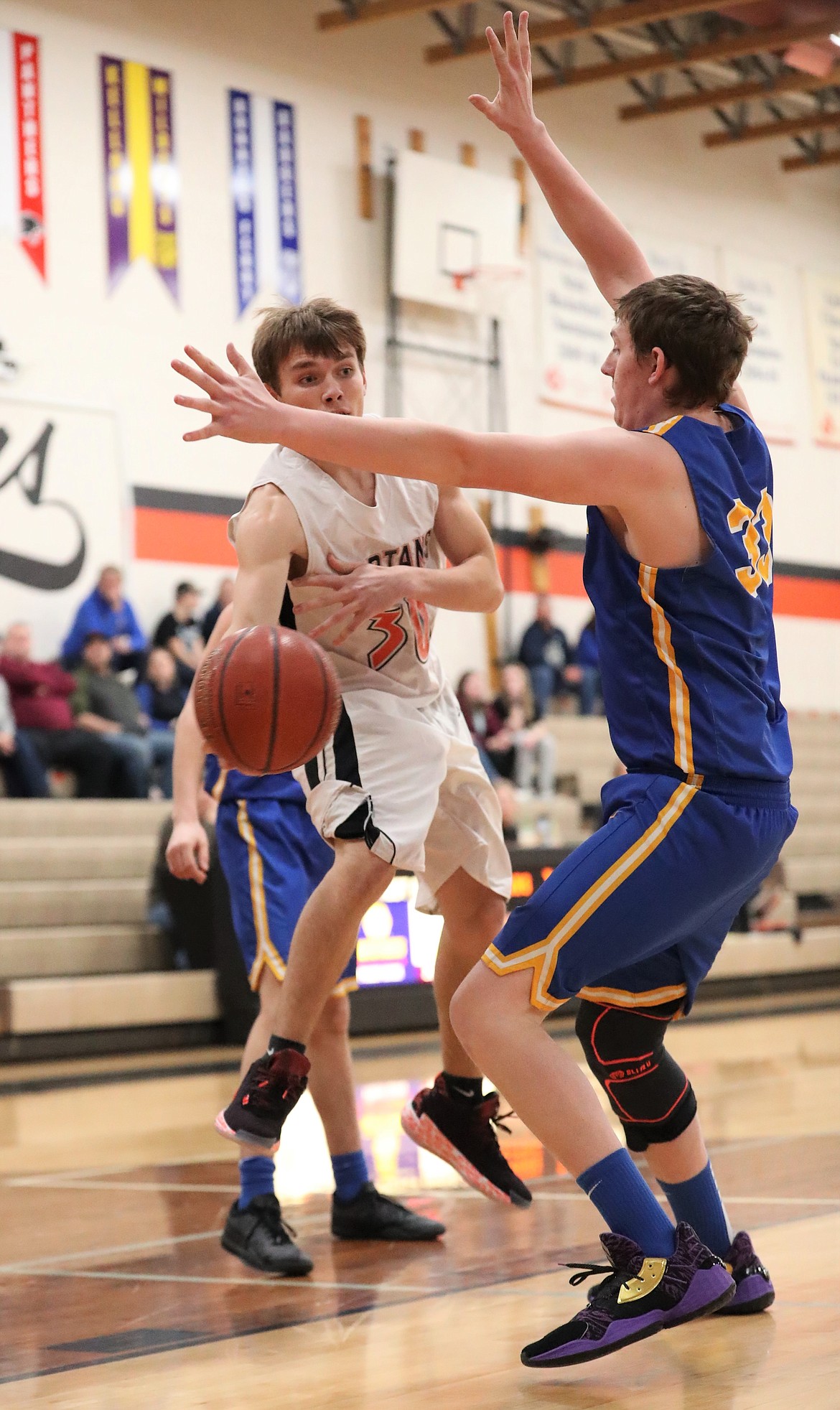 Priest River's Jordan Nortz (left) tries to sneak a pass behind Clark Fork's Chris Wade on Tuesday.