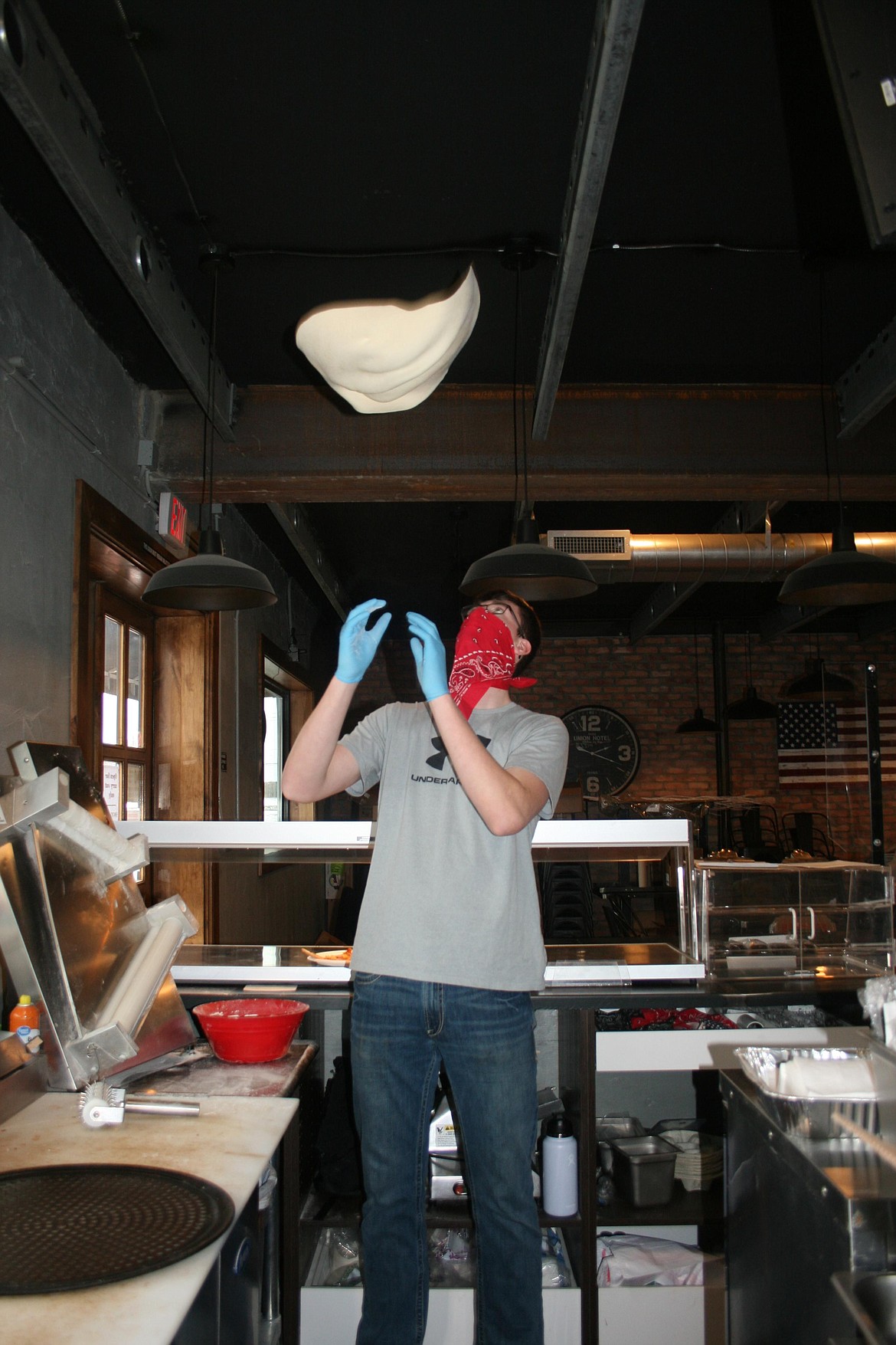 Ethan Small works the pizza dough in the kitchen at Smulligan's, the Small family restaurant in Royal City. Ethan's dad Warren said his original motivation was to learn to make good barbecue, and learning to make good pizza was an unexpected benefit.