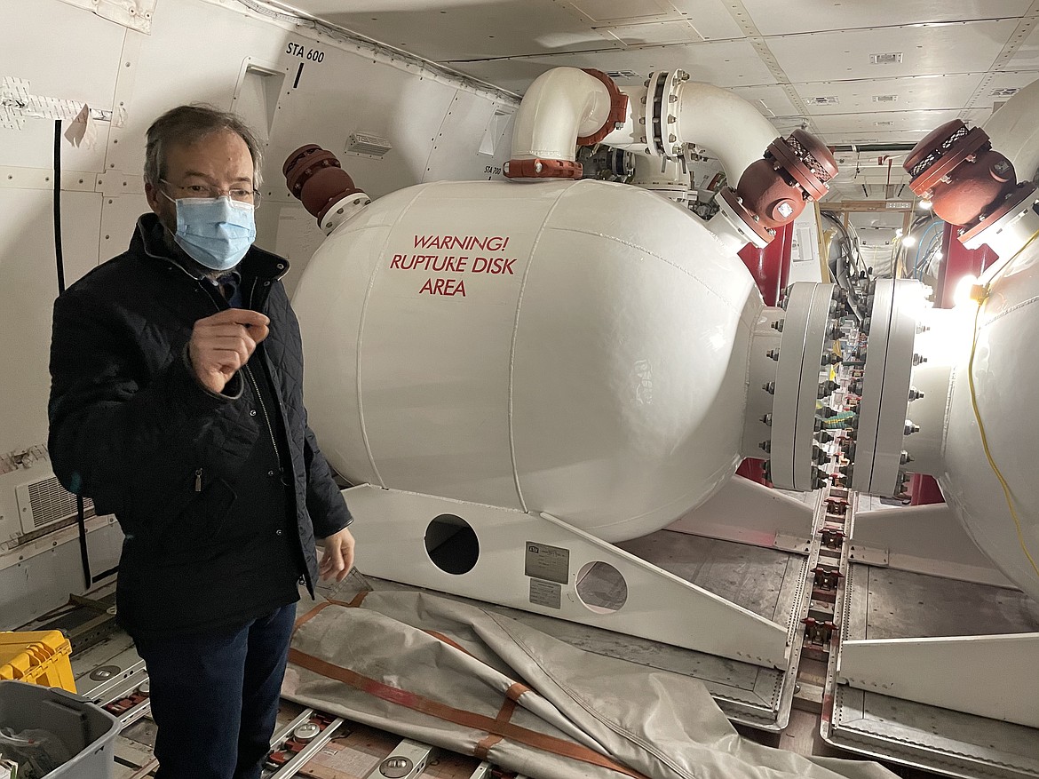AeroTEC CEO and President Lee Human shows off several of the tanks and pumps inside the Global Supertanker, a 747 converted to carry fire retardant to disperse at low altitude on wildfires.