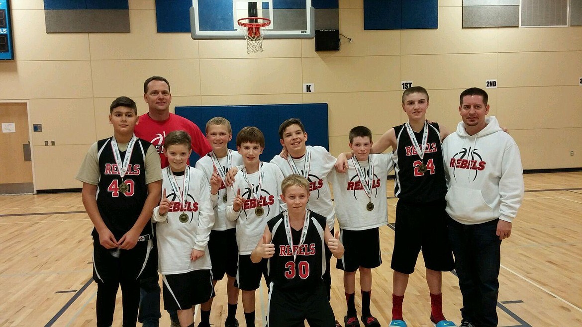 Courtesy photo
As sixth-graders, Alex Horning, Caden McLean and Cole Rutherford played on a River City Running Rebels team that won an AAU tournament in Wenatchee. In the front is Tristan White; second row from left, Jalen Skalskiy (40), coach Eric Ballew, Caden McLean (11), Isaac Ballew (31), Tommy Hauser (12), Josiah Shields (1), Cole Rutherford (10), Alex Horning (24) and coach Nick Meeks. White is a senior at Post Falls High who played football in high school; Skalskiy is a senior on Lakeland High's basketball team; and the other boys are all seniors on the Post Falls High boys basketball team.