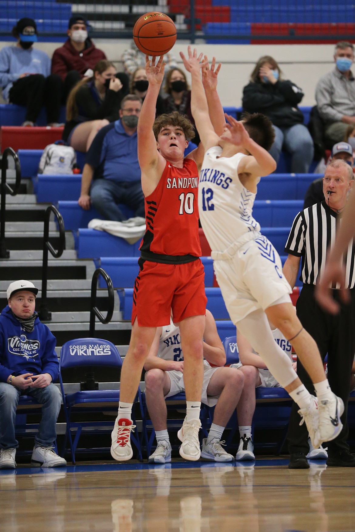 Arie VanDenBerg attempts a 3-pointer over the outstretched arm of a Coeur d'Alene defender on Thursday.