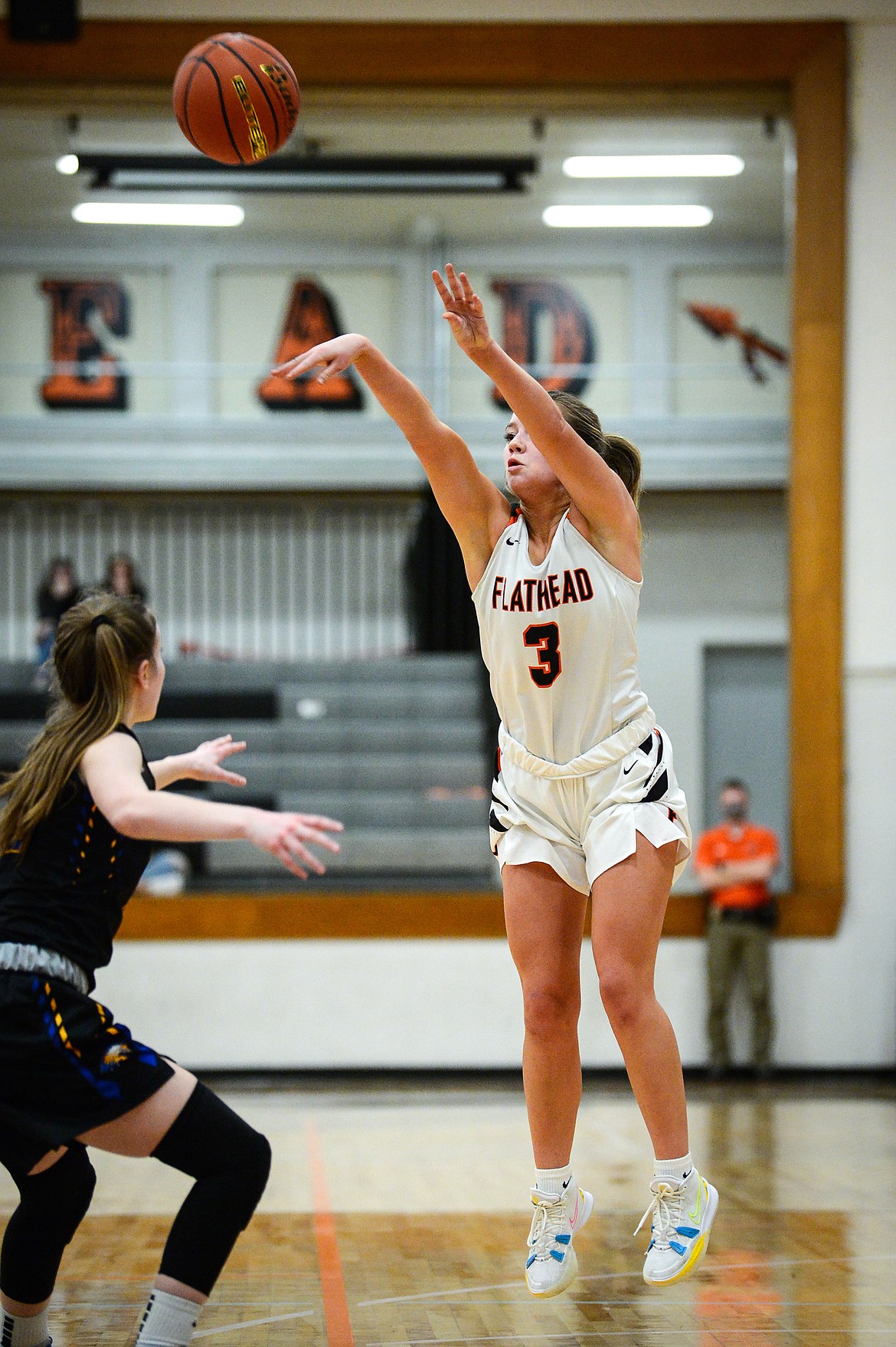 Flathead's Kuyra Siegel (3) drains a deep three in the second quarter against Missoula Big Sky at Flathead High School on Thursday. (Casey Kreider/Daily Inter Lake)