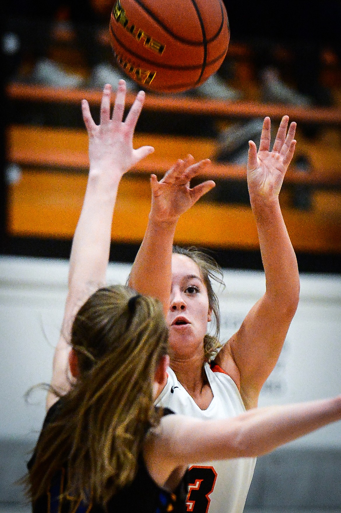Flathead's Kuyra Siegel (3) spots up for a three guarded by Missoula Big Sky's Audrey Hale (12) at Flathead High School on Thursday. (Casey Kreider/Daily Inter Lake)