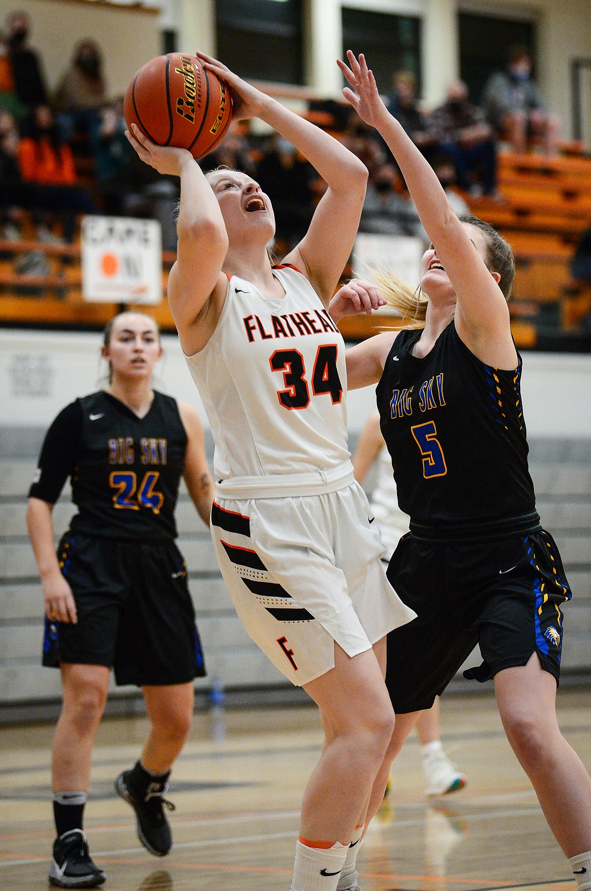 Flathead's Molly Winters (34) rises to the hoop with Missoula Big Sky's Avari Batt (5) defending at Flathead High School on Thursday. (Casey Kreider/Daily Inter Lake)