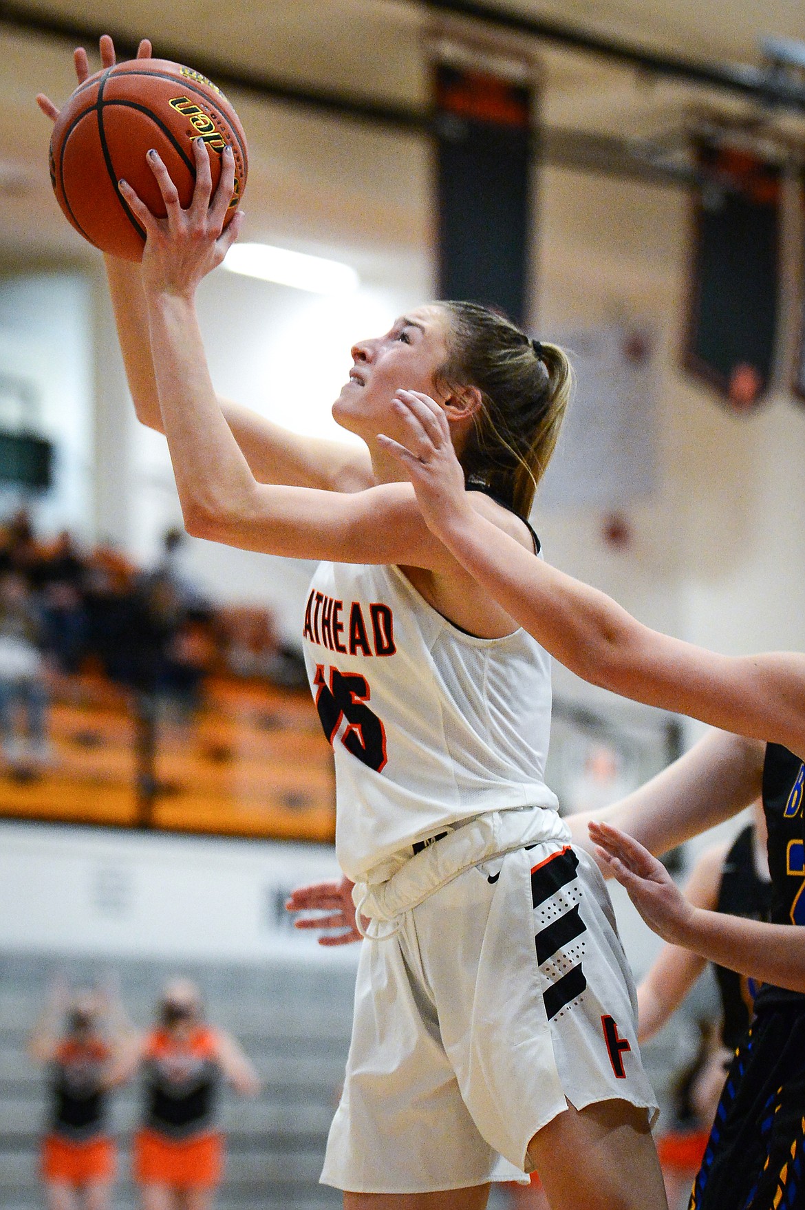 Flathead's Clare Converse (15) rises to the hoop against Missoula Big Sky at Flathead High School on Thursday. (Casey Kreider/Daily Inter Lake)