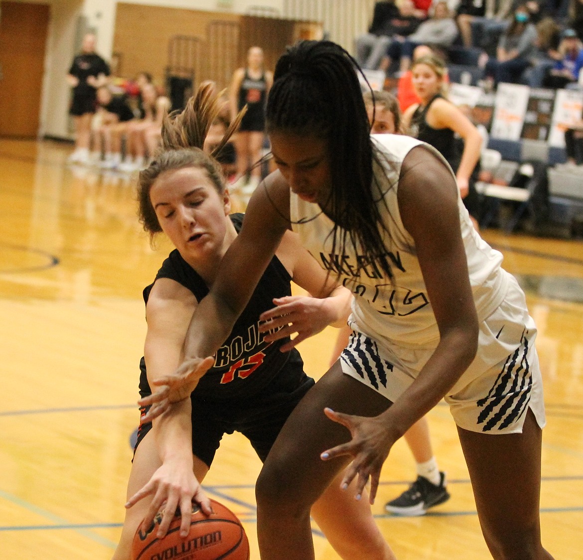 JASON ELLIOTT/Press
Post Falls forward Capri Sims attempts to steal the ball away from Lake City forward Tanai Jenkins during the third quarter of Friday's 5A Region 1 basketball tournament game at Lake City High.