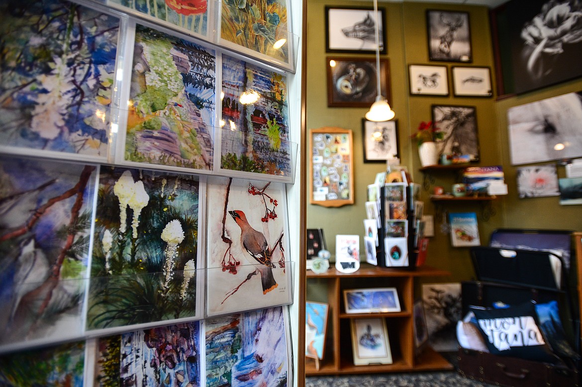 A collection of artwork by local artists Lois Sturgis, left, and Michaela Eaves, right, at Paint, Metal & Mud in Kalispell on Friday, Feb. 5. (Casey Kreider/Daily Inter Lake)