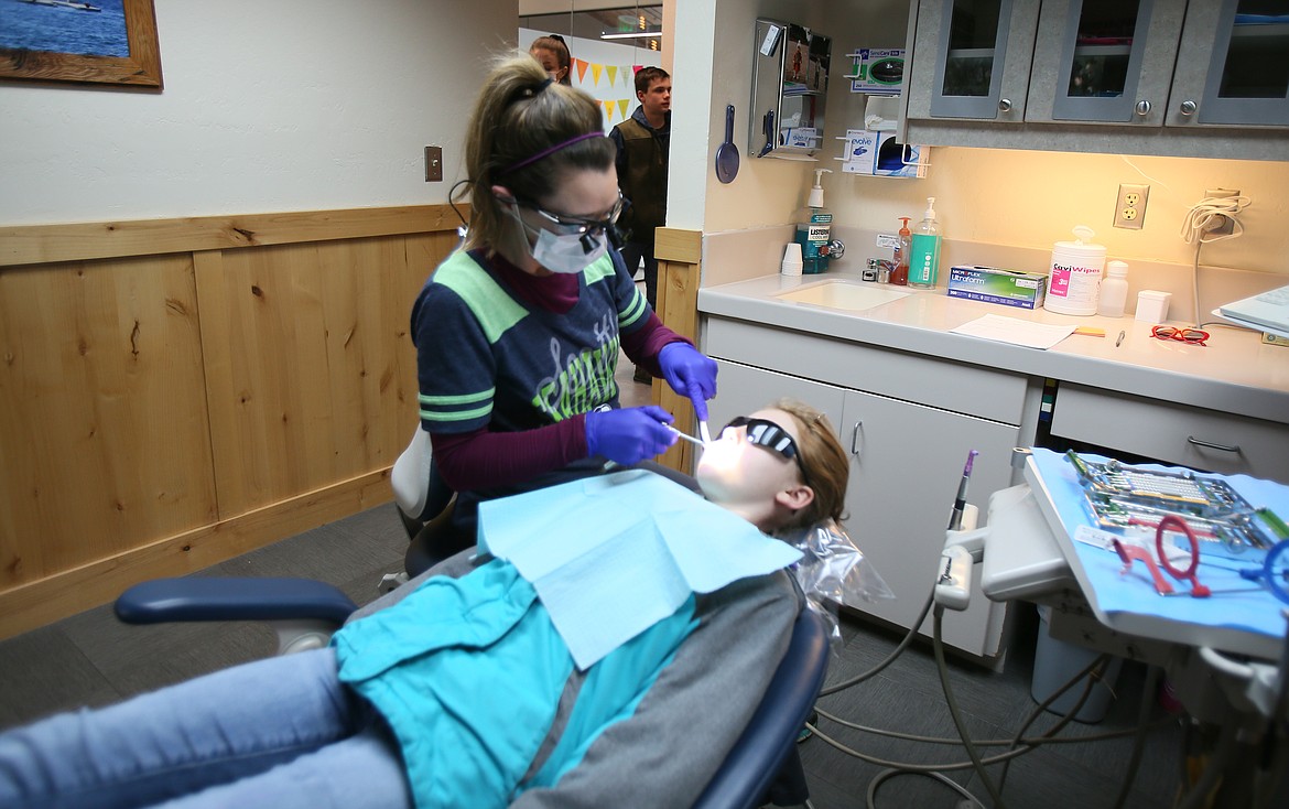 Avondale Dental hygienist Tiffany Cannon conducts a cleaning on 11-year-old Gabriella Jacobs on Friday during the American Dental Association's Give Kids a Smile event, which provides underserved children with free oral health care. Avondale has participated in the event for at least 20 years.