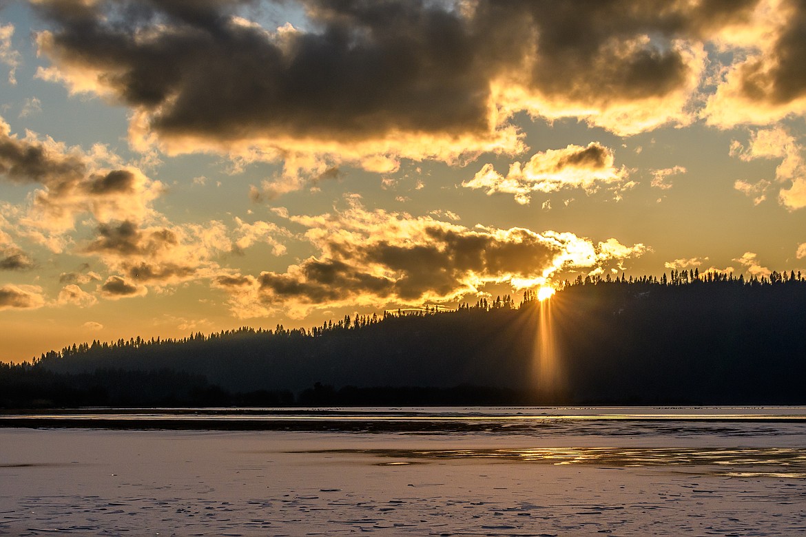 Photo by Ron Reeve
The setting sun peeks through the clouds and casts a golden glow on Killarney Lake on a recent winter day.